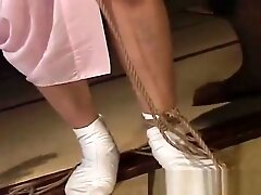 Mature bitch gets roped up and hung in a bdsm session