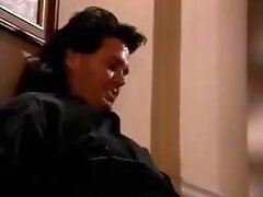 Selena Steele blows a guy in the hallway