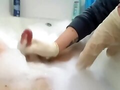 Bathtub latex glove handjob